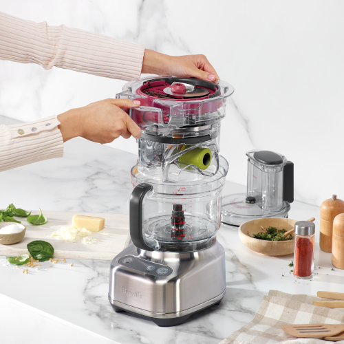 The integrated storage caddy being placed inside the paradice 9 bowl